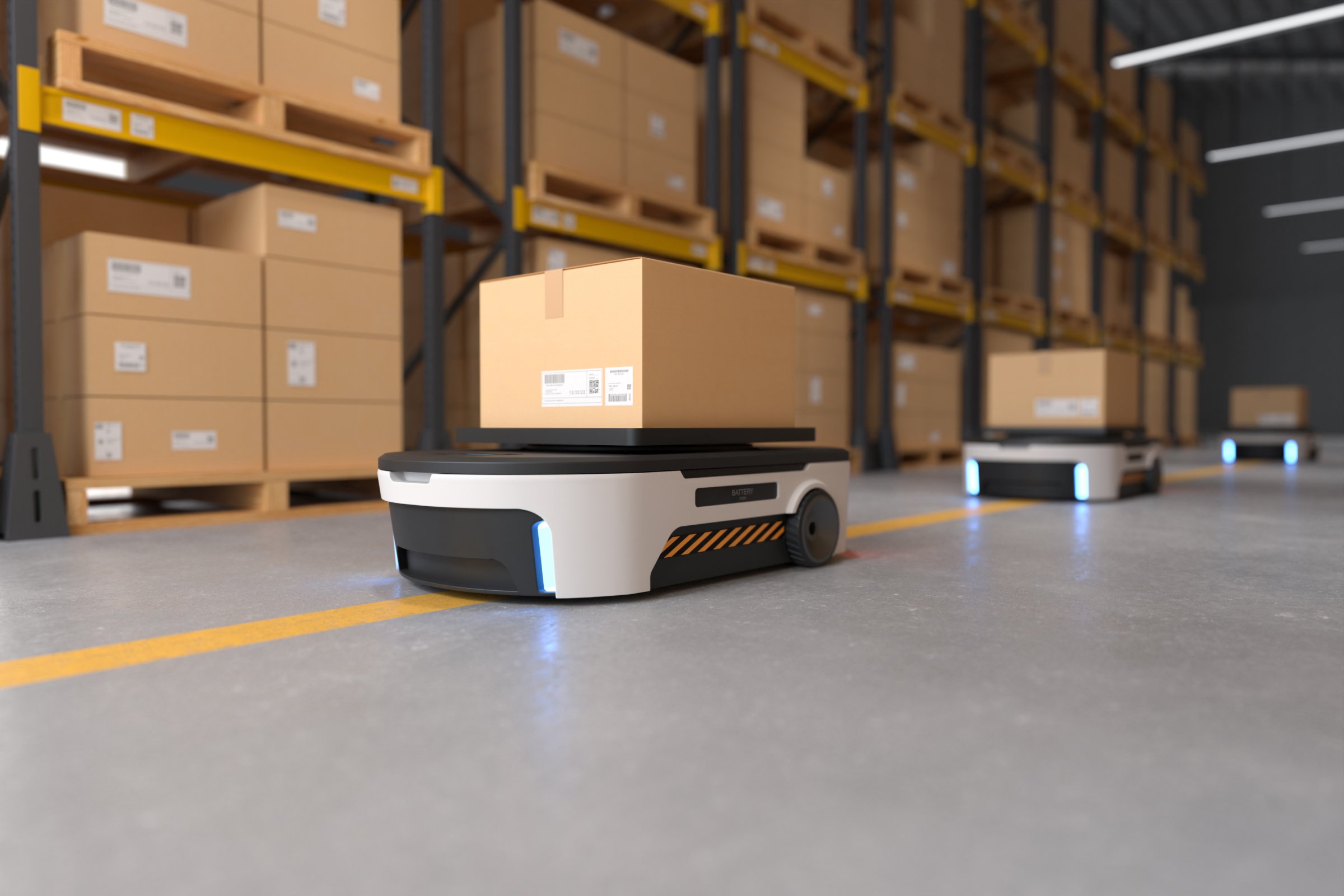 Robot transporterar paket i ett automatiserat lagersystem